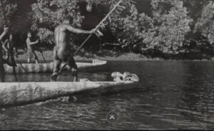 Asmat Man in his canoe